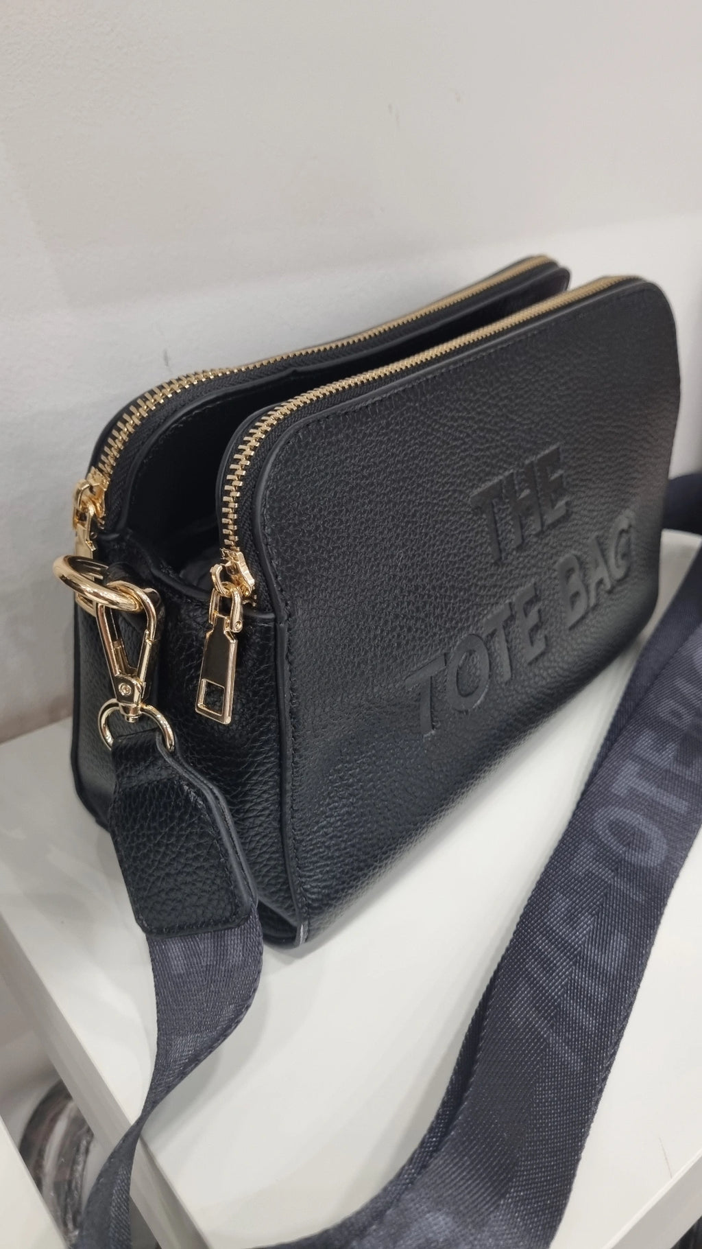 Black triple compartment crossbody bag