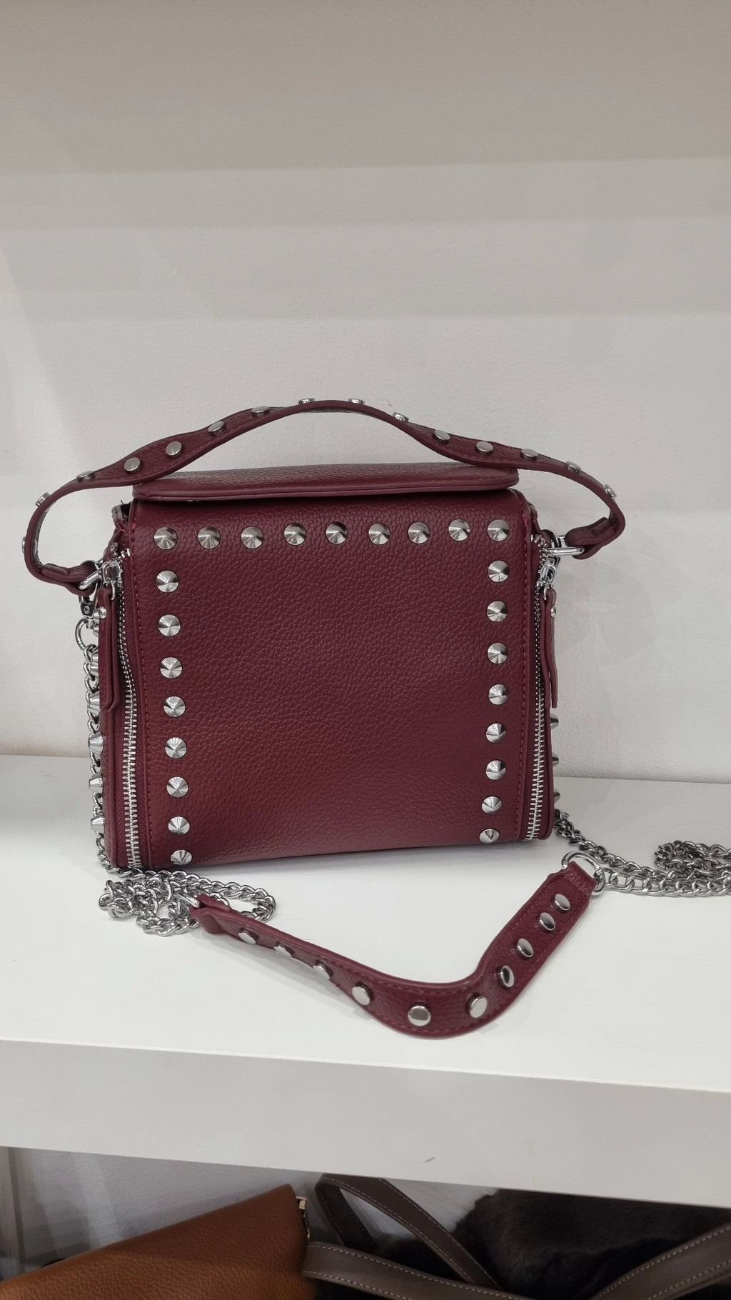 Studded crossbody bag in burgandy