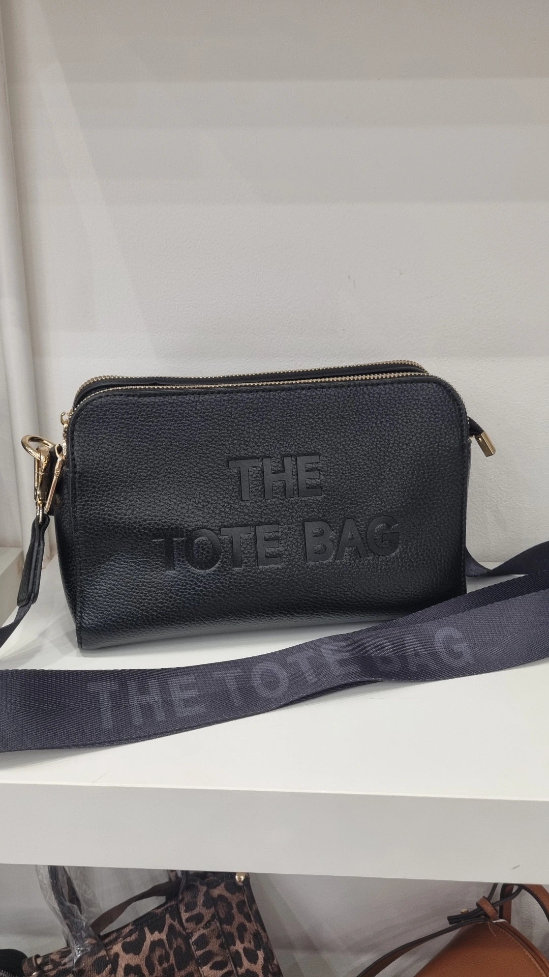 Black triple compartment crossbody bag