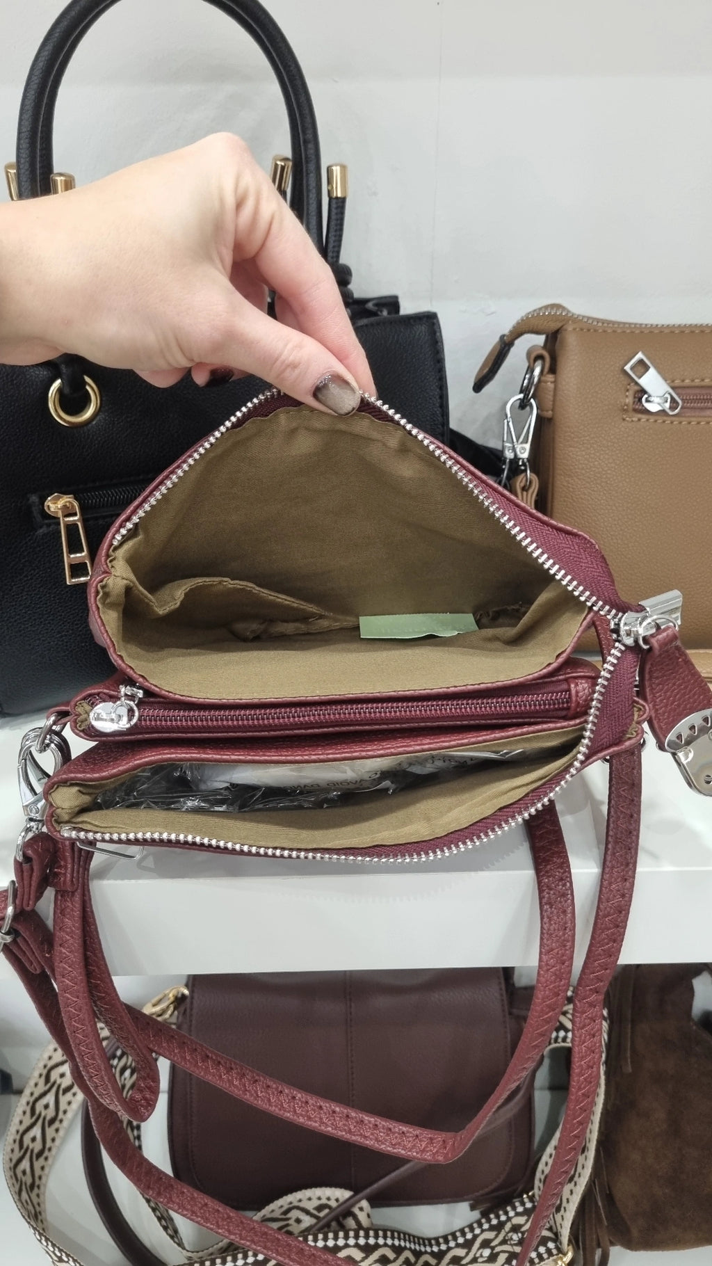 Clasp crossbody bag in burgandy