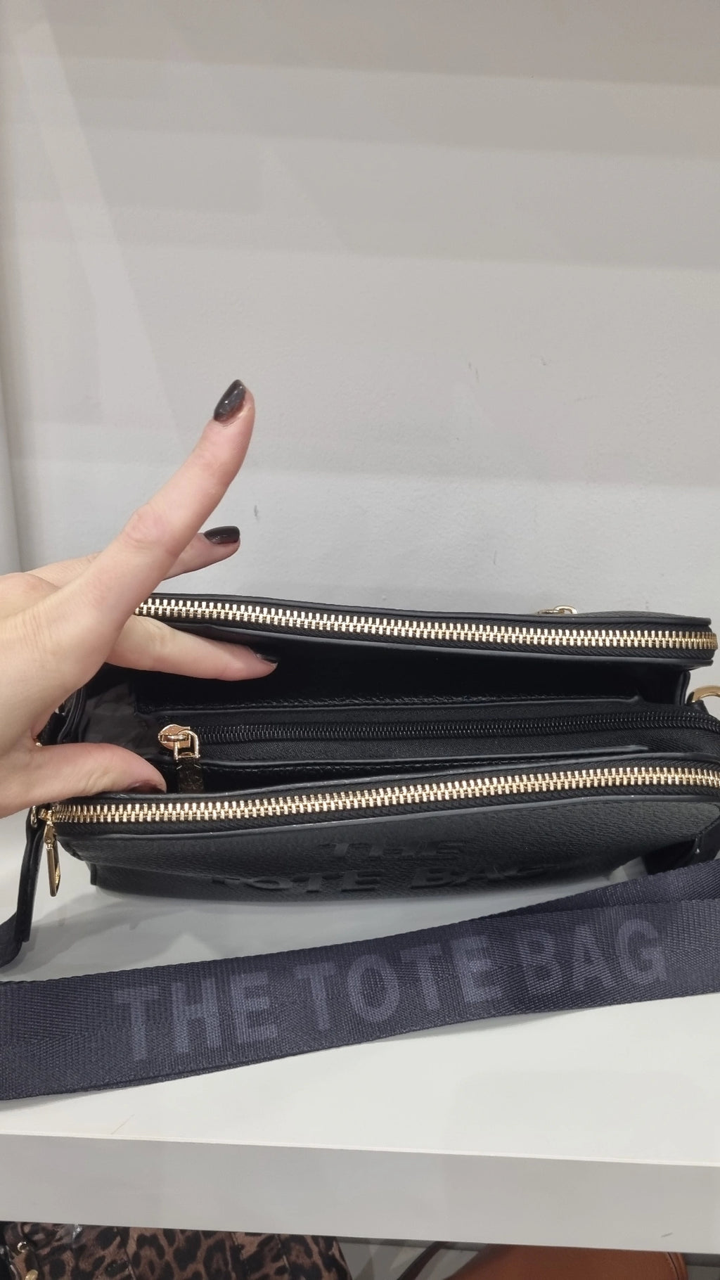 Black triple compartment crossbody bag