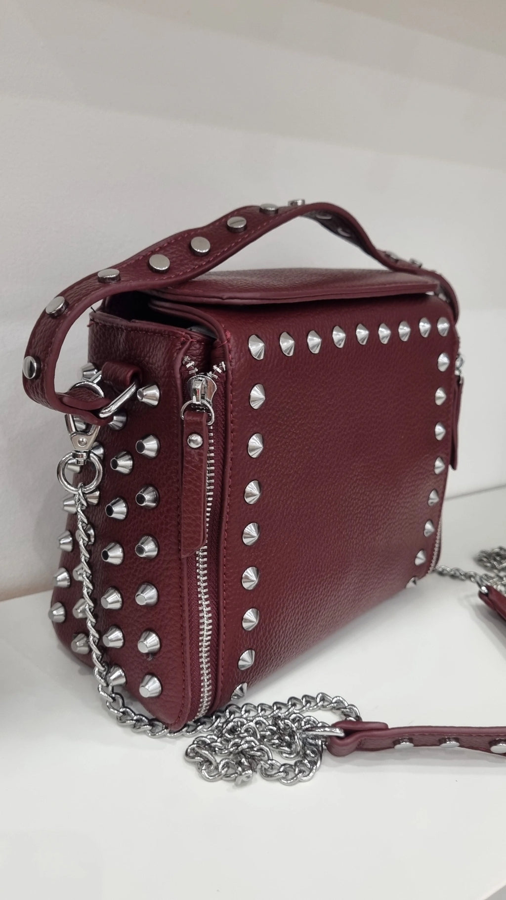 Studded crossbody bag in burgandy